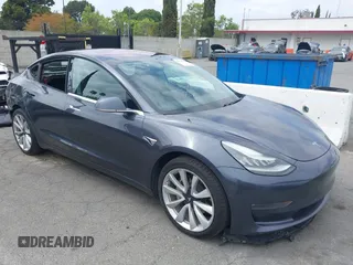 2018 Tesla Model 3 Long Range Battery with VIN 5YJ3E1EA8JF059385, listed as a IAAI auction lot 42116589 with 63,630 mi miles and . Bid and sale history available at DreamBid. Image 1.