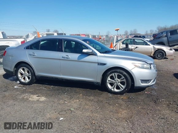 2013 Ford Taurus SEL with VIN 1FAHP2E8XDG164903, listed as a IAAI auction lot 41580690 with 163,128 mi miles and . Bid and sale history available at carsss.com. Image 13.