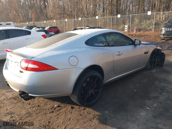 2014 Jaguar XK with VIN SAJWA4DC7EMB52199, listed as a IAAI auction lot 41191119 with 90,585 mi miles. Bid and sale history available at carsss.com. Image 4.