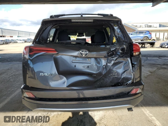 2018 Toyota RAV4 XLE with VIN JTMRFREV5JJ739620, listed as a Copart auction lot 48218185 with 82,885 mi miles and Salvage Title. Bid and sale history available at DreamBid. Image 6.