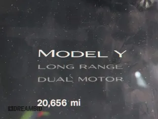 2023 Tesla Model Y Long Range with VIN 7SAYGDEE0PF909610, listed as a IAAI auction lot 41906081 with 20,656 mi miles and . Bid and sale history available at DreamBid. Image 16.