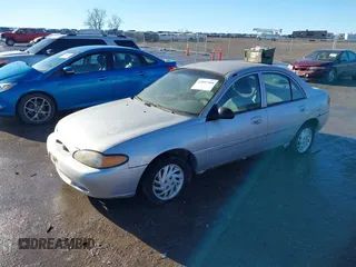 1999 Ford Escort SE with VIN 1FAFP13P8XW185612, listed as a IAAI auction lot 41097304 with 221,752 mi miles. Bid and sale history available at carsss.com. Image 2.