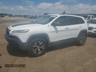 2015 Jeep Cherokee Trailhawk with VIN 1C4PJMBSXFW651000, listed as a Copart auction lot 64110515 with 135,571 mi miles and Clean title. Bid and sale history available at DreamBid. Image 1.