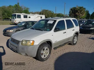 2002 Ford Escape XLT with VIN 1FMCU03112KC92704, listed as a IAAI auction lot 41807550 with 105,762 mi miles and . Bid and sale history available at DreamBid. Image 2.