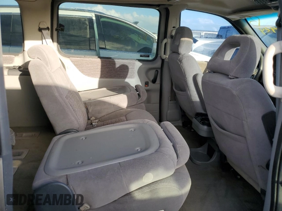 1998 Pontiac Montana z VIN 1GMDX03EXWD344453, wystawiony jako Copart lot #77226424 z przebiegiem Nie podano mil oraz Szkoda całkowita • Salvage title. Historia ofert i sprzedaży dostępna na DreamBid. Obrazek 11.