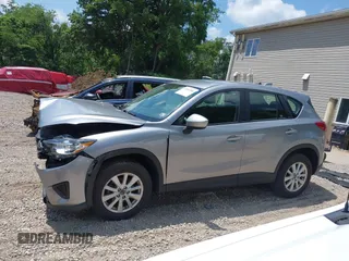 2014 Mazda CX-5 Sport with VIN JM3KE2BEXE0329303, listed as a IAAI auction lot 42556908 with 127,836 mi miles and . Bid and sale history available at DreamBid. Image 14.