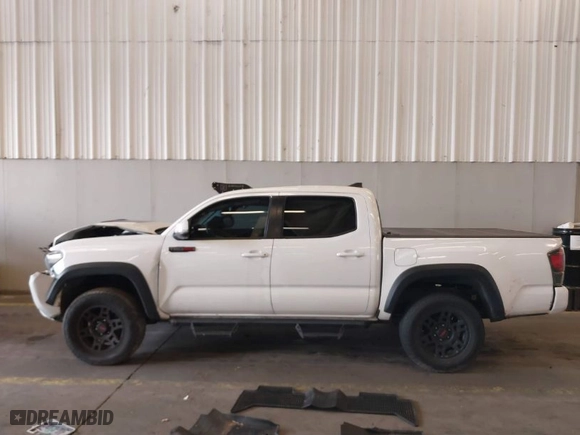 2019 Toyota Tacoma 4WD SR with VIN 5TFCZ5AN0KX209923, listed as a IAAI auction lot 41144153 with 50,605 mi miles. Bid and sale history available at carsss.com. Image 14.