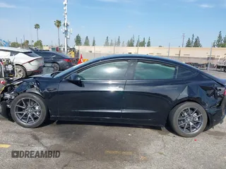 2022 Tesla Model 3 Long Range with VIN 5YJ3E1EB6NF233131, listed as a IAAI auction lot 41819409 with 38,308 mi miles and . Bid and sale history available at DreamBid. Image 13.