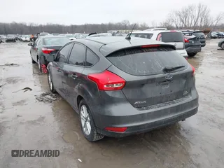 2015 Ford Focus SE with VIN 1FADP3K26FL383355, listed as a IAAI auction lot 41520459 with 142,111 mi miles and . Bid and sale history available at DreamBid. Image 3.