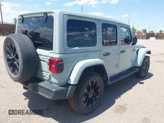 2023 Jeep Wrangler Sahara with VIN 1C4JJXP68PW627007, listed as a IAAI auction lot 42474745 with 57,912 mi miles and . Bid and sale history available at DreamBid. Image 4.