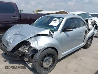 2013 Volkswagen Beetle 2.5L with VIN 3VWJX7AT7DM673319, listed as a IAAI auction lot 42169554 with 128,622 mi miles and . Bid and sale history available at DreamBid. Image 2.