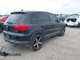 2014 Volkswagen Tiguan SE z VIN WVGAV3AXXEW535128, wystawiony jako IAAI lot #41882213 z przebiegiem 103 161 mil mil oraz . Historia ofert i sprzedaży dostępna na DreamBid. Obrazek 4.