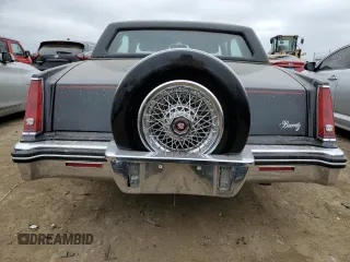 1985 Cadillac Eldorado z VIN 1G6EL5782FE634074, wystawiony jako Copart lot #44520964 z przebiegiem 74 425 mil mil oraz Szkody całkowita. Historia ofert i sprzedaży dostępna na DreamBid. Obrazek 6.