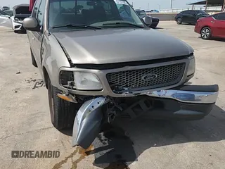 2001 Ford F-150 XLT z VIN 1FTRW07L01KB30498, wystawiony jako Copart lot #57157585 z przebiegiem 343 041 mil mil oraz Szkoda całkowita • Salvage title. Historia ofert i sprzedaży dostępna na DreamBid. Obrazek 13.