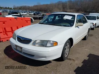 1998 Mazda 626 DX with VIN 1YVGF22CXW5702980, listed as a IAAI auction lot 41778063 with 104,672 mi miles. Bid and sale history available at carsss.com. Image 2.