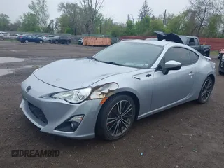 2015 Scion FR-S z VIN JF1ZNAA10F9704134, wystawiony jako IAAI lot #42167308 z przebiegiem 130 242 mil mil oraz . Historia ofert i sprzedaży dostępna na DreamBid. Obrazek 2.