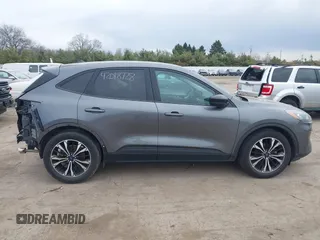 2021 Ford Escape SE z VIN 1FMCU0G62MUA94307, wystawiony jako IAAI lot #42018728 z przebiegiem 142 662 mil mil oraz . Historia ofert i sprzedaży dostępna na DreamBid. Obrazek 14.