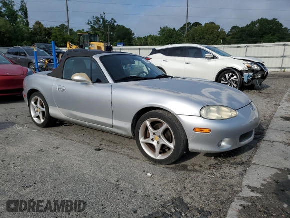 2003 Mazda MX-5 Miata Cloth z VIN JM1NB353630305964, wystawiony jako Copart lot #58517505 z przebiegiem 129 675 mil mil oraz Szkoda całkowita • Salvage title. Historia ofert i sprzedaży dostępna na DreamBid. Obrazek 4.
