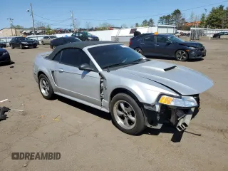 1999 Ford Mustang with VIN 1FAFP4448XF233101, listed as a Copart auction lot 54701005 with 54,585 mi miles and Salvage title. Bid and sale history available at DreamBid. Image 4.