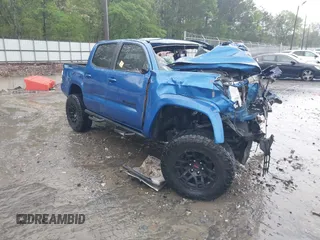 2017 Toyota Tacoma SR5 z VIN 5TFAZ5CN2HX039819, wystawiony jako IAAI lot #41964403 z przebiegiem Nie podano mil oraz . Historia ofert i sprzedaży dostępna na DreamBid. Obrazek 1.
