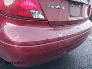 2002 Ford Taurus SE Standard z VIN 1FAFP53U32G242170, wystawiony jako IAAI lot #41299039 z przebiegiem 99 928 mil mil oraz . Historia ofert i sprzedaży dostępna na DreamBid. Obrazek 13.