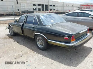 1982 Jaguar XJ with VIN SAJAV1248CC341050, listed as a IAAI auction lot 42653594 with Not provided miles and . Bid and sale history available at DreamBid. Image 3.