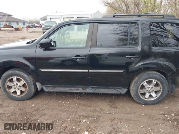 2009 Honda Pilot Touring with VIN 5FNYF48959B016978, listed as a IAAI auction lot 41947782 with 234,115 mi miles and . Bid and sale history available at carsss.com. Image 14.