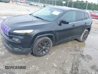 2014 Jeep Cherokee Latitude with VIN 1C4PJLCS4EW106479, listed as a IAAI auction lot 42283214 with 179,029 mi miles and . Bid and sale history available at DreamBid. Image 2.