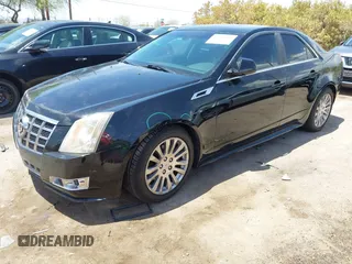 2012 Cadillac CTS Premium with VIN 1G6DP5E35C0129064, listed as a IAAI auction lot 42666308 with 151,694 mi miles and . Bid and sale history available at DreamBid. Image 2.