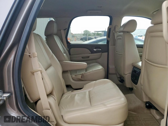 2011 GMC Yukon SLT z VIN 1GKS1CE01BR359134, wystawiony jako Copart lot #53693295 z przebiegiem 95 060 mil mil oraz Szkoda całkowita • Salvage title. Historia ofert i sprzedaży dostępna na DreamBid. Obrazek 11.