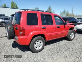2002 Jeep Liberty Limited with VIN 1J8GL58K42W328443, listed as a Copart auction lot 52768345 with 218,459 mi miles and Salvage title. Bid and sale history available at DreamBid. Image 3.