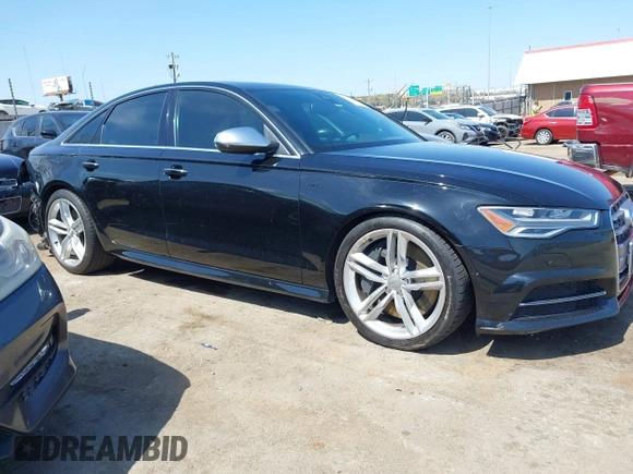 2016 Audi S6 Prestige z VIN WAUH2AFC6GN130251, wystawiony jako IAAI lot #41912382 z przebiegiem 72 512 mil mil oraz . Historia ofert i sprzedaży dostępna na DreamBid. Obrazek 13.