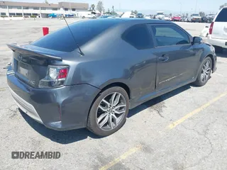 2015 Scion tC with VIN JTKJF5C74F3090309, listed as a IAAI auction lot 41988036 with 158,240 mi miles. Bid and sale history available at carsss.com. Image 4.