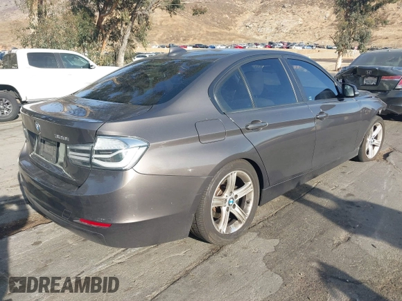 2013 BMW 3 Series 328i with VIN WBA3A5C52DJ462202, listed as a IAAI auction lot 41198588 with 145,010 mi miles. Bid and sale history available at carsss.com. Image 4.
