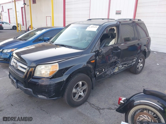 2006 Honda Pilot EX-L with RES with VIN 5FNYF28616B029670, listed as a IAAI auction lot 41425494 with 206,756 mi miles. Bid and sale history available at carsss.com. Image 2.