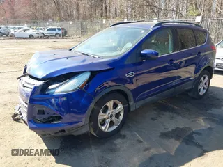 2013 Ford Escape SE with VIN 1FMCU9GX5DUB20394, listed as a IAAI auction lot 41889989 with 121,417 mi miles. Bid and sale history available at carsss.com. Image 2.