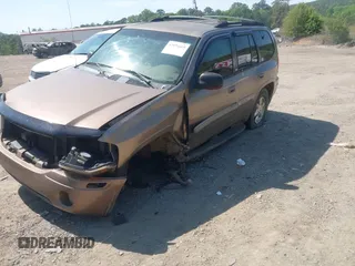 2003 GMC Envoy SLT with VIN 1GKDS13S832208655, listed as a IAAI auction lot 42076668 with 160,787 mi miles. Bid and sale history available at carsss.com. Image 14.