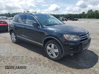 2011 Volkswagen Touareg z VIN WVGFG9BP5BD002225, wystawiony jako Copart lot #59926795 z przebiegiem 154 212 mil mil oraz Czysty tytuł • Clean title. Historia ofert i sprzedaży dostępna na DreamBid. Obrazek 4.