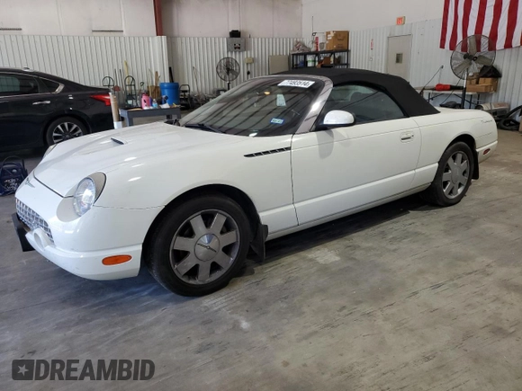 2002 Ford Thunderbird Hardtop Premium with VIN 1FAHP60A32Y125580, listed as a Copart auction lot 77493514 with 74,619 mi miles and Salvage Title. Bid and sale history available at DreamBid. Image 1.