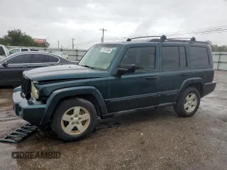 2006 Jeep Commander with VIN 1J8HH48NX6C125803, listed as a Copart auction lot 71247304 with 214,297 mi miles and Salvage Title. Bid and sale history available at carsss.com. Image 1.