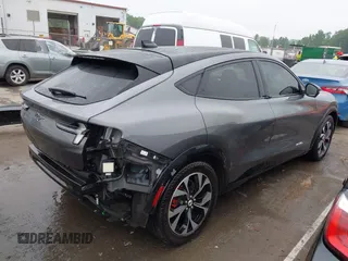 2021 Ford Mustang Mach-E Premium z VIN 3FMTK3R74MMA27709, wystawiony jako IAAI lot #42102335 z przebiegiem 54 988 mil mil oraz . Historia ofert i sprzedaży dostępna na DreamBid. Obrazek 4.