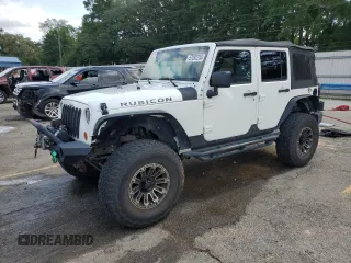 2010 Jeep Wrangler Unlimited Rubicon with VIN 1J4BA6H10AL176014, listed as a Copart auction lot 57092255 with 138,253 mi miles and Salvage title. Bid and sale history available at DreamBid. Image 1.