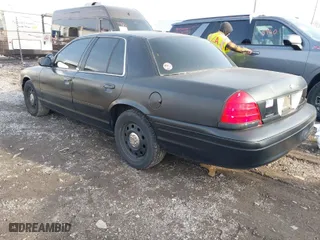 2006 Ford Police Interceptor with VIN 2FAHP71W76X142677, listed as a IAAI auction lot 41173196 with 152,236 mi miles. Bid and sale history available at carsss.com. Image 3.