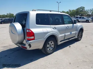 2003 Mitsubishi Montero LTD with VIN JA4NW51S53J030850, listed as a IAAI auction lot 42063733 with 210,810 mi miles. Bid and sale history available at carsss.com. Image 4.