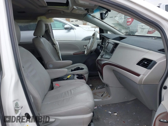 2011 Toyota Sienna XLE with VIN 5TDDK3DC0BS015244, listed as a IAAI auction lot 41413002 with 128,591 mi miles. Bid and sale history available at carsss.com. Image 5.