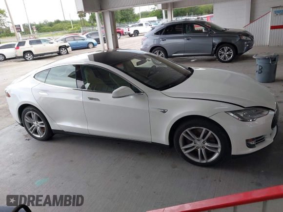 2014 Tesla Model S 60 with VIN 5YJSA1S16EFP53350, listed as a IAAI auction lot 42239753 with 104,985 mi miles and . Bid and sale history available at DreamBid. Image 13.