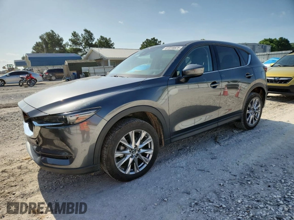 2020 Mazda CX-5 Grand Touring z VIN JM3KFADM2L0803589, wystawiony jako Copart lot #61916825 z przebiegiem 63 663 mil mil oraz Szkoda całkowita • Salvage title. Historia ofert i sprzedaży dostępna na DreamBid. Obrazek 1.