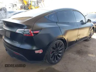 2022 Tesla Model Y Performance z VIN 7SAYGDEF0NF491586, wystawiony jako IAAI lot #42276747 z przebiegiem 117 203 mil mil oraz . Historia ofert i sprzedaży dostępna na DreamBid. Obrazek 4.