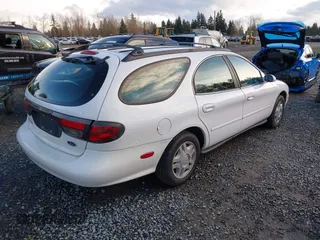 1999 Ford Taurus SE Standard with VIN 1FAFP58U5XG200924, listed as a IAAI auction lot 41501093 with 105,102 mi miles and . Bid and sale history available at DreamBid. Image 4.