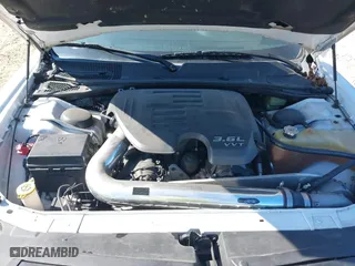 2013 Dodge Challenger SXT with VIN 2C3CDYAG6DH737253, listed as a IAAI auction lot 40615411 with 133,973 mi miles. Bid and sale history available at carsss.com. Image 10.